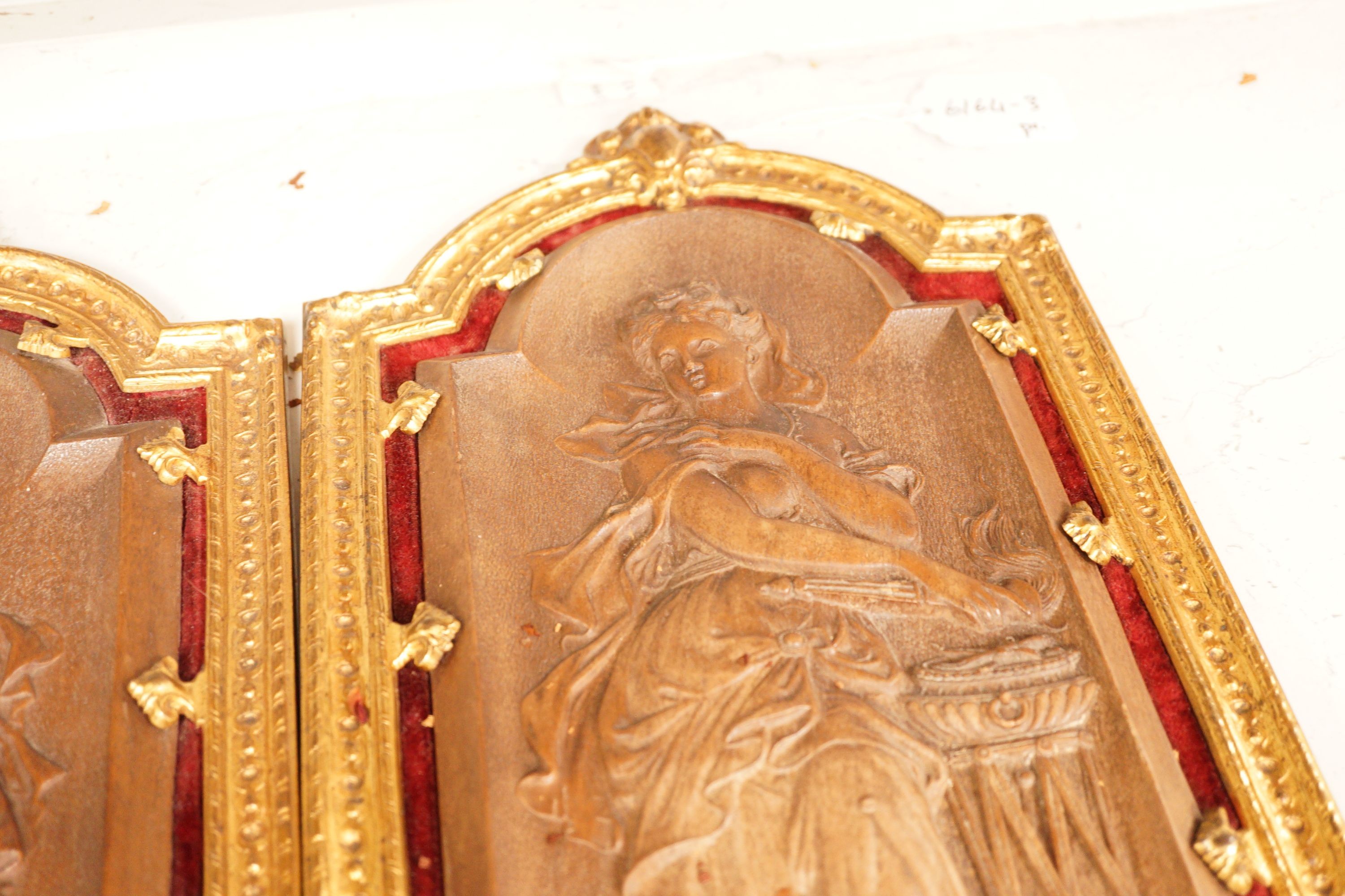 A pair of 19th century French ormolu mounted bois durci plaques, 50cm